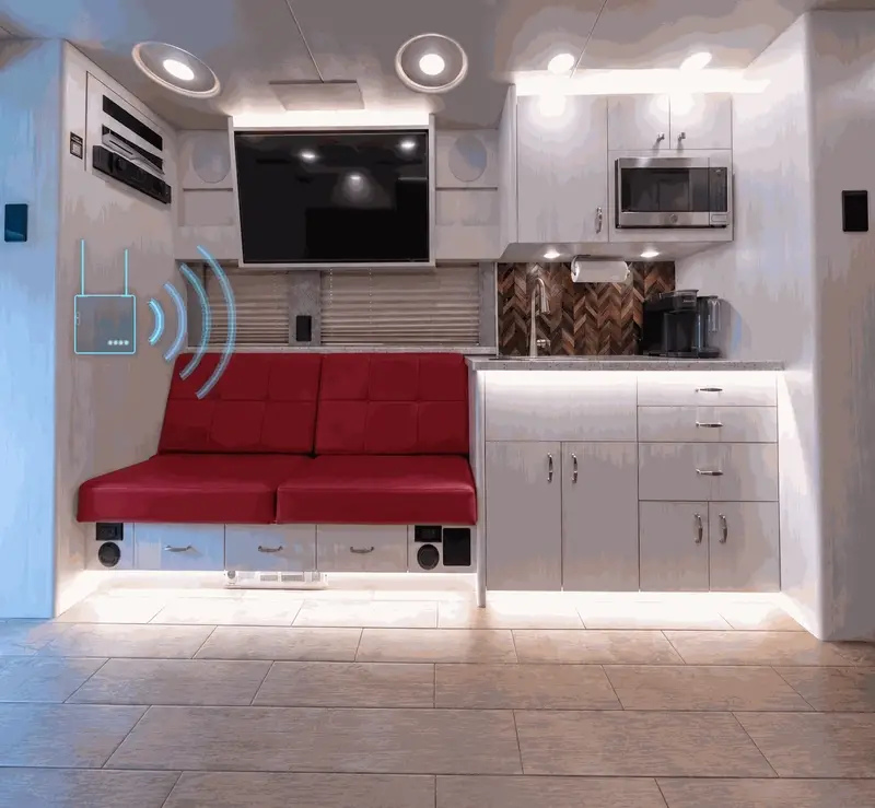 Animated illustration of a concealed KIT Fleet router broadcasting WiFi inside a tour bus lounge