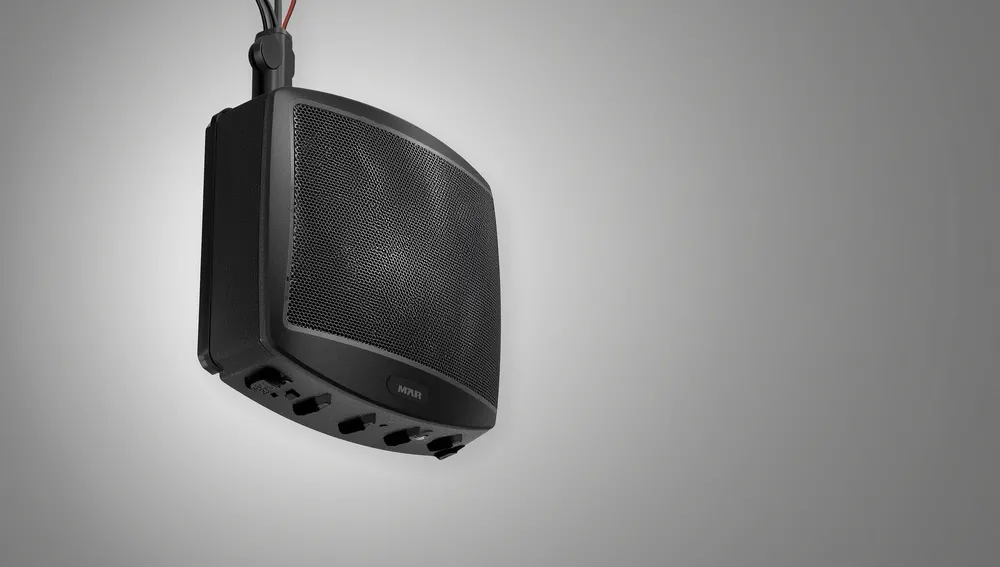 Commercial overhead paging speaker mounted in a warehouse