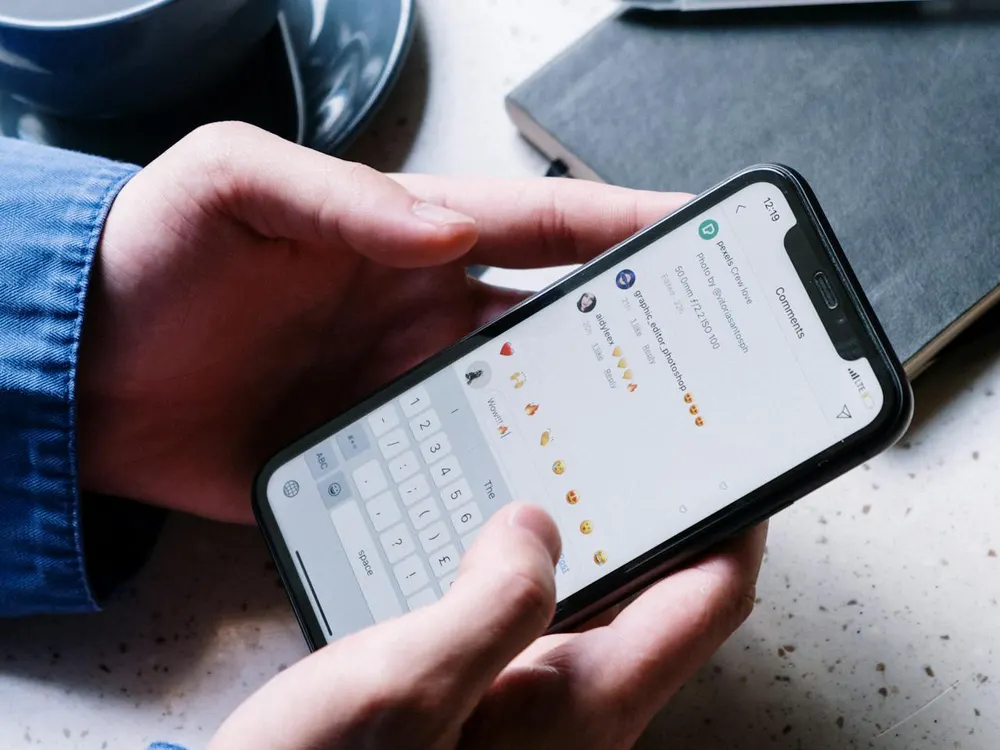 Person scrolling a business social media feed on a smartphone